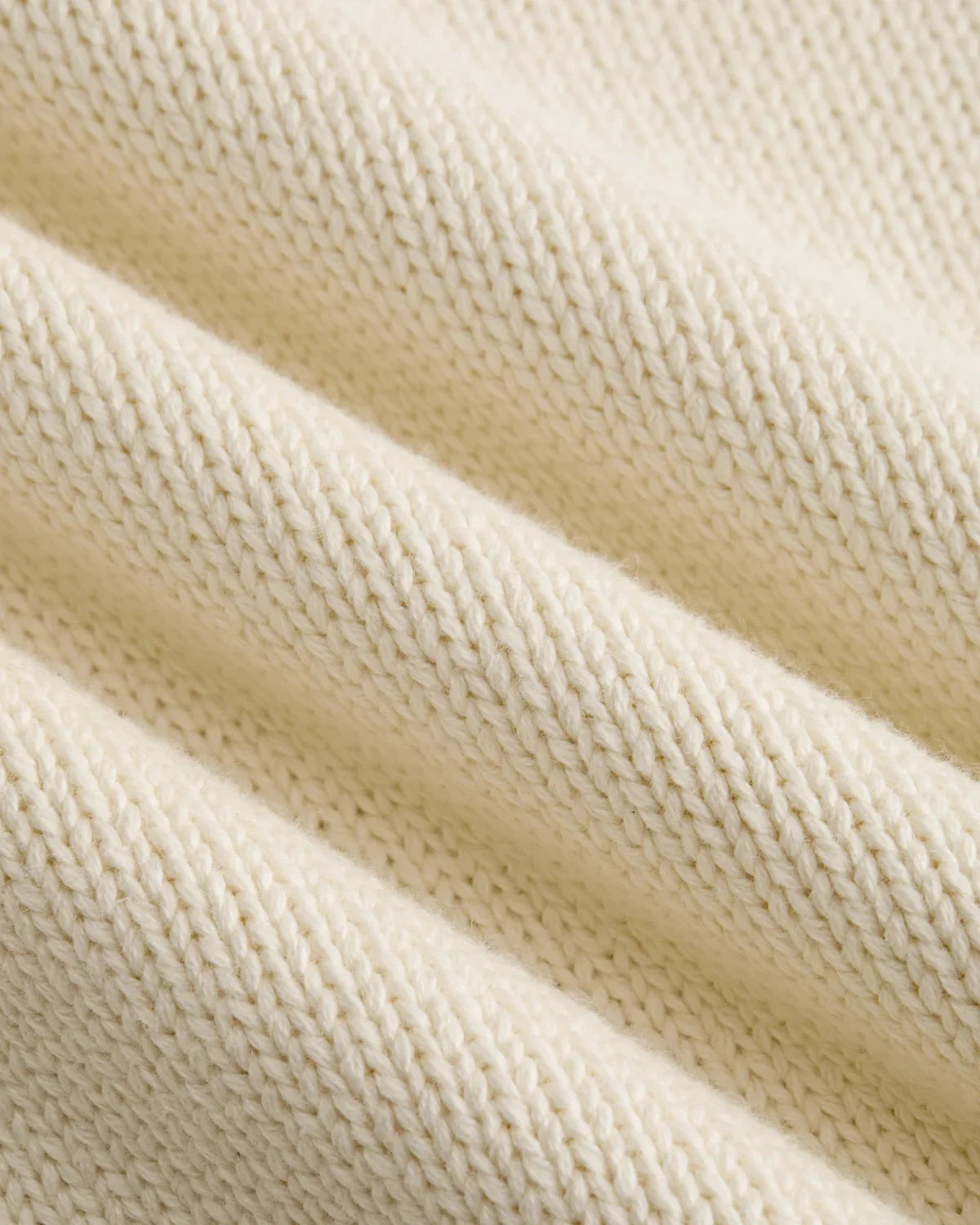 Detalle del punto grueso de algodón color crema del jersey Staple NY