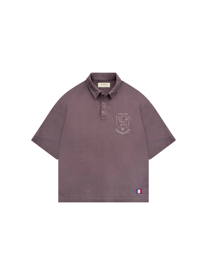 Polo Reternity L'Atelier de la Rue marrón Corte boxy y Cropped, Bordado detalle en el pecho y parche en la espalda.