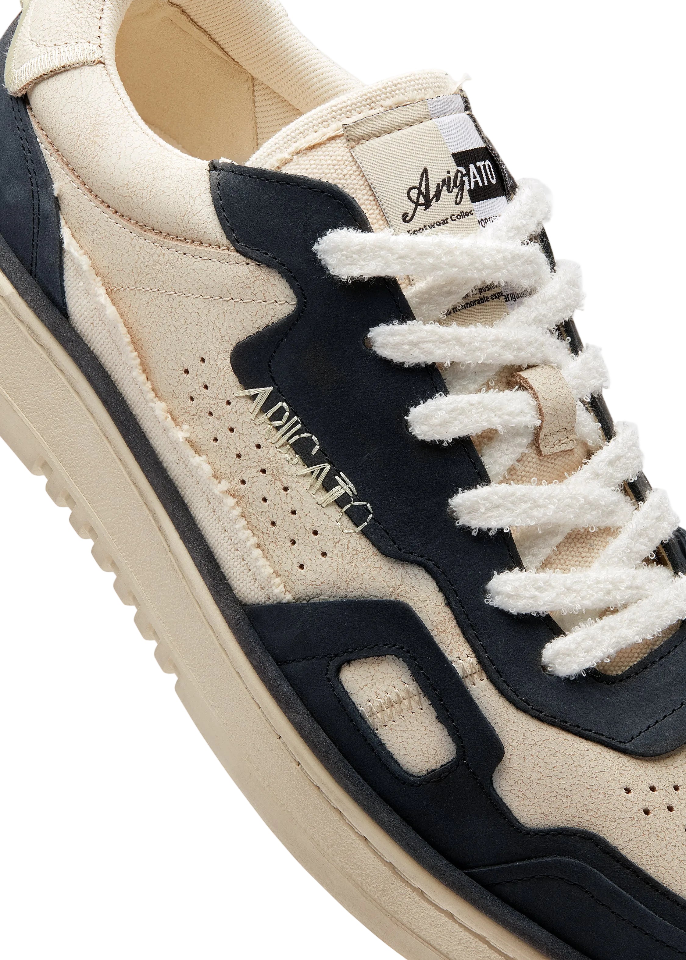 Axel Arigato Dice Patchwork Sneaker perfil lateral detalle paneles y cordones