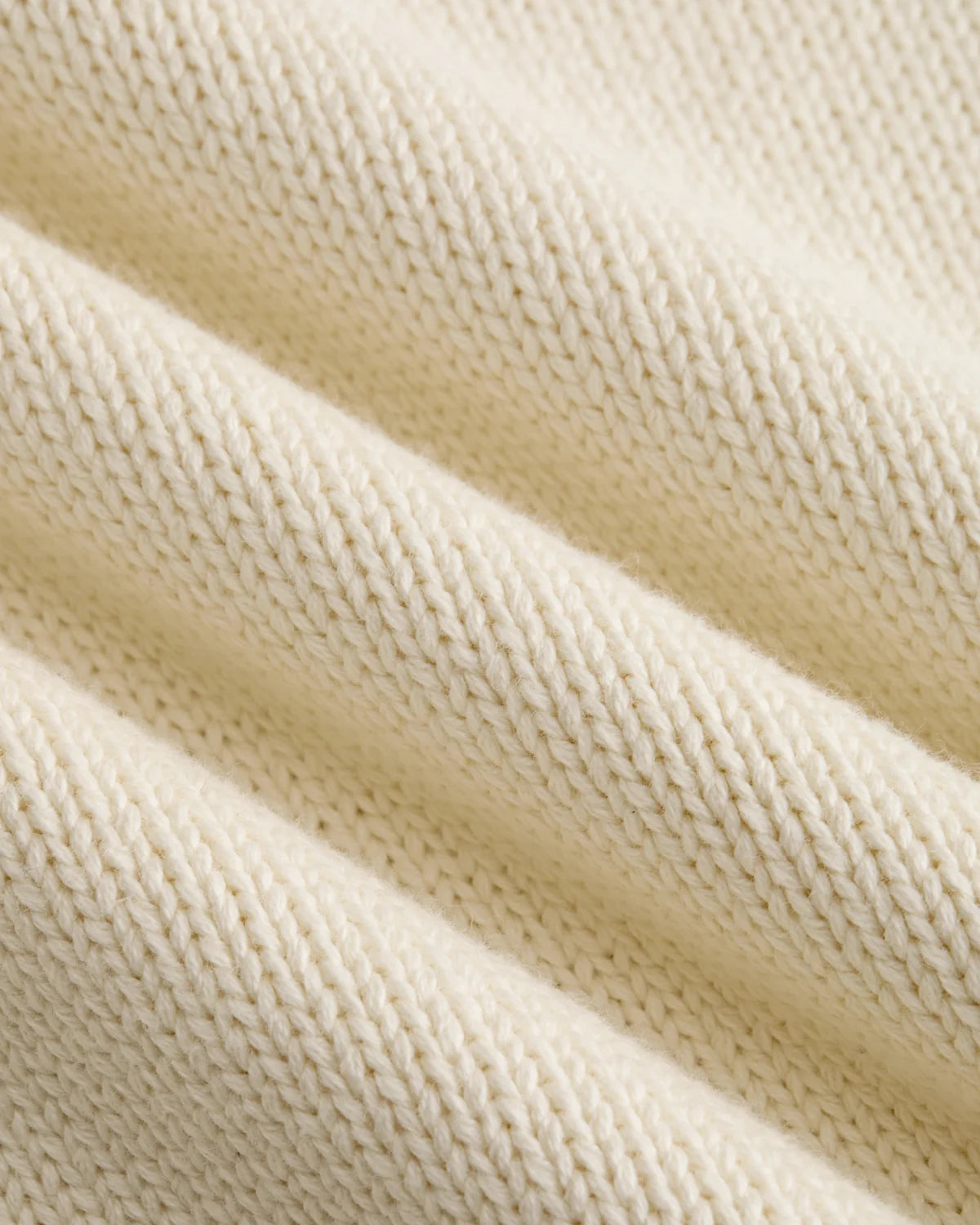 Detalle del punto grueso de algodón color crema del jersey Staple NY